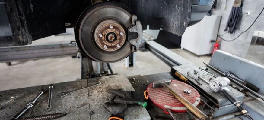 How do I properly bed in new brake pads and rotors?